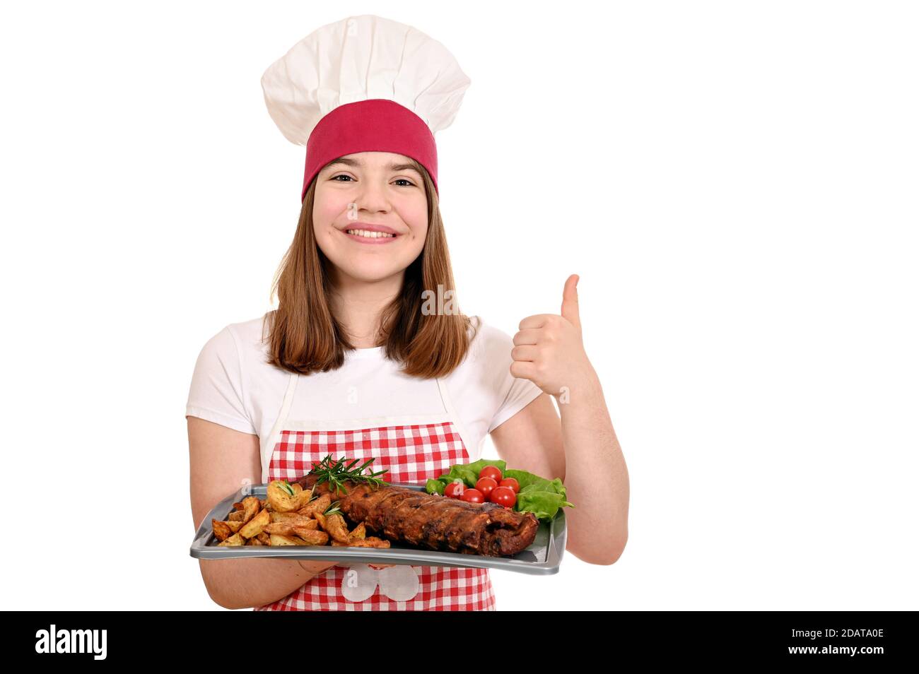 happy girl cook with pork ribs at plate and thumb up Stock Photo