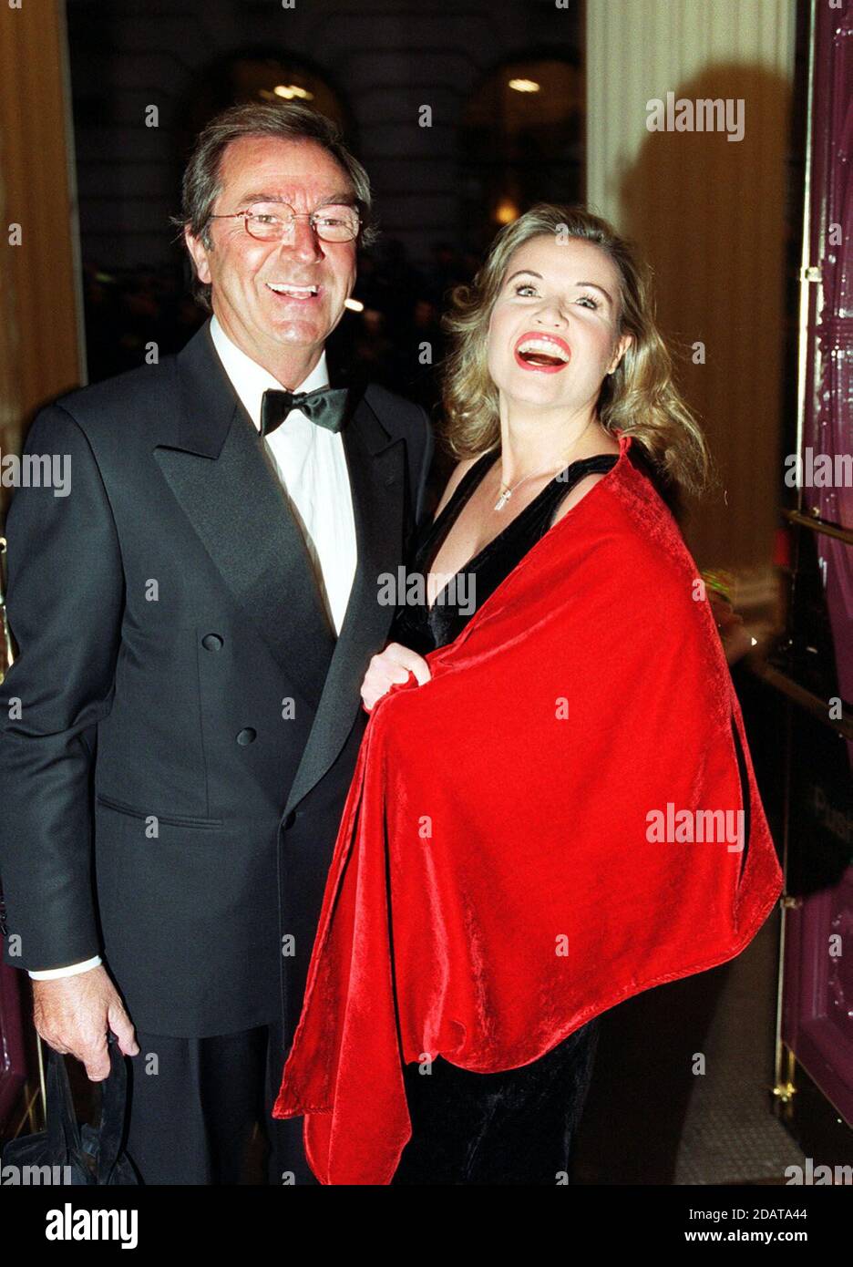 File photo dated 19/10/1999 of Des O'Connor, and partner, singer Jodie Wilson. Des O'Connor, 88, who sadly passed away on Saturday 14 November. His agent confirmed he had been admitted to hospital just over a week ago, following a fall at his home in Buckinghamshire. Unfortunately yesterday evening his condition suddenly deteriorated and he drifted peacefully away in his sleep. Stock Photo