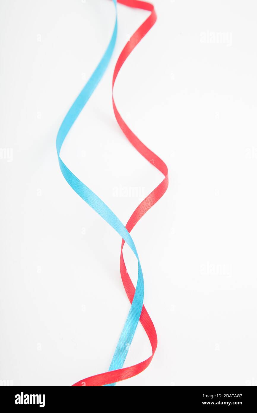 Vertical interweaving red and blue wavy ribbons on white Stock Photo ...