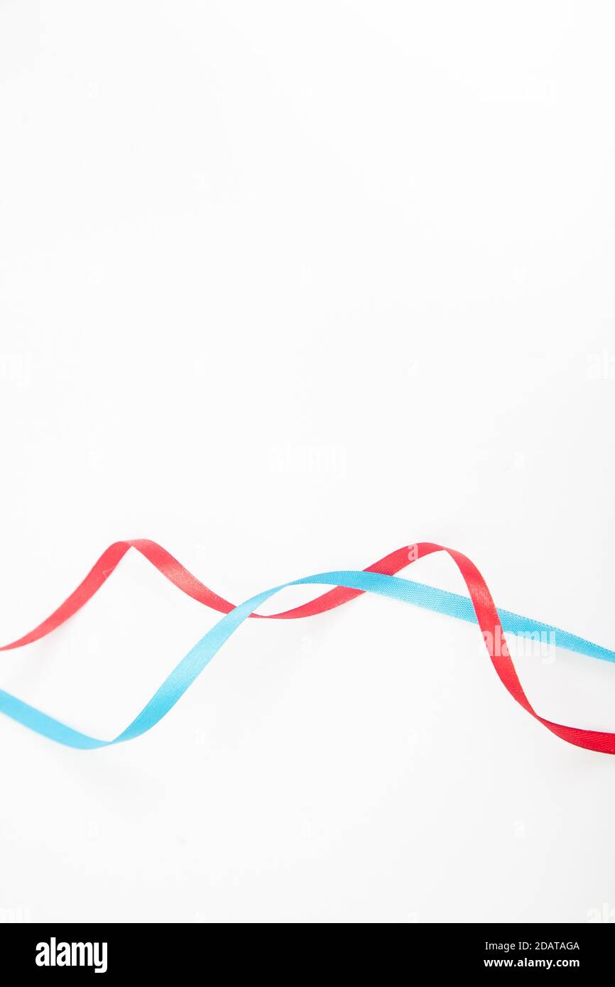 Vertical interweaving red and blue wavy ribbons with copy space Stock ...