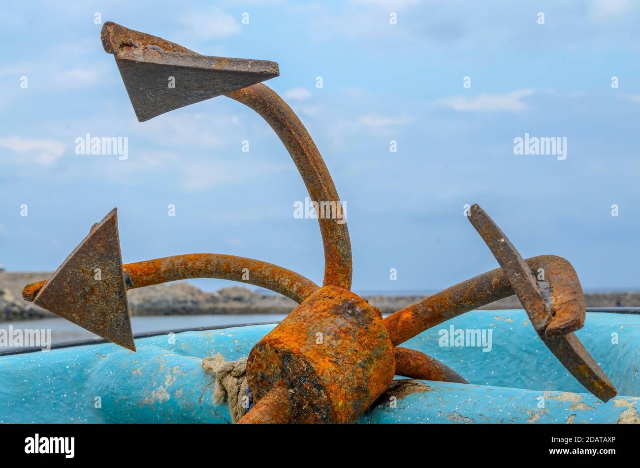 Closeup of an old, rusty anchor on an old fishing boat in Muscat, Oman Stock Photo