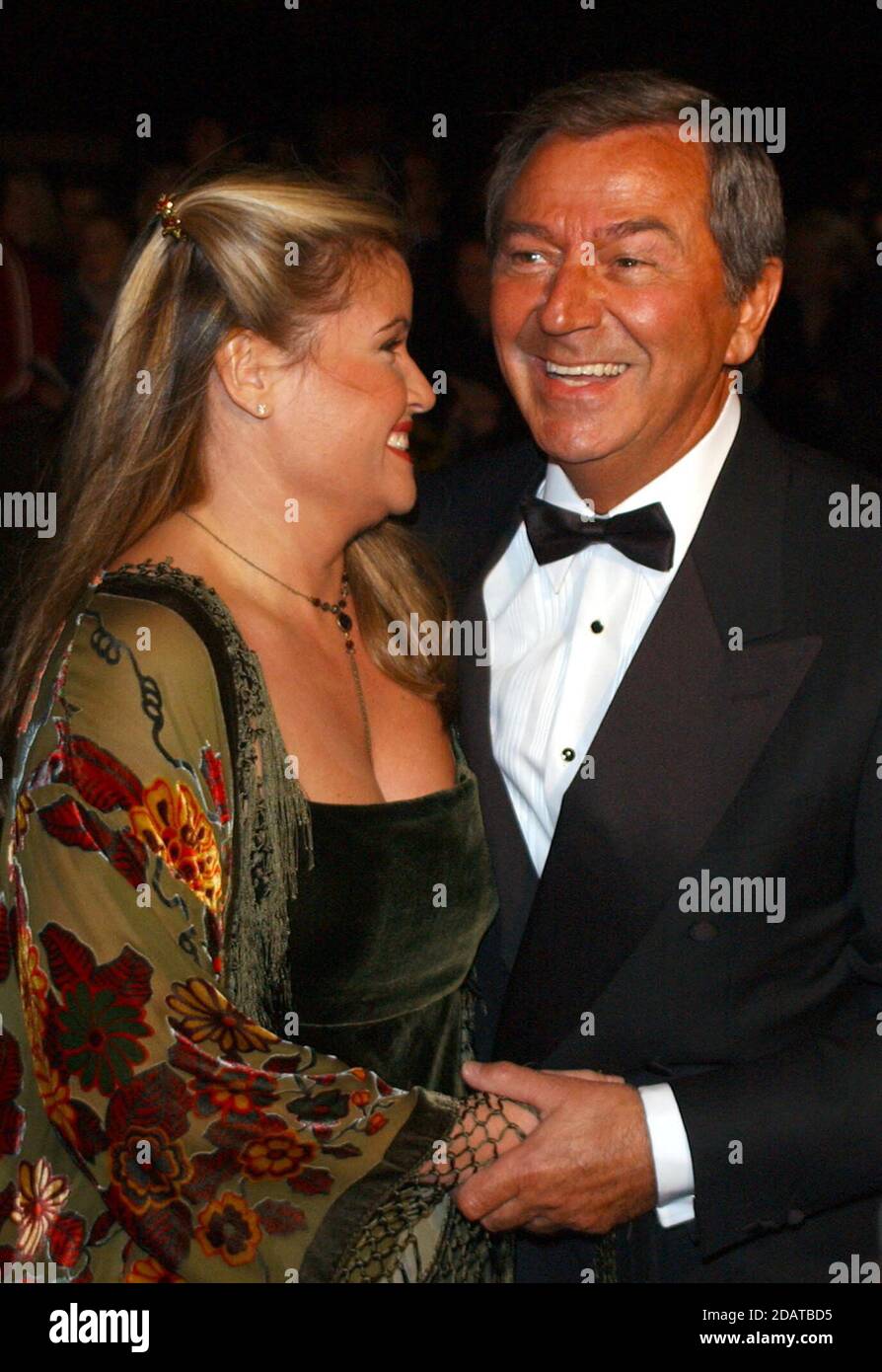 File photo dated 15/10/2002 of Des O'Connor, and wife, singer Jodie Wilson. Des O'Connor, 88, who sadly passed away on Saturday 14 November. His agent confirmed he had been admitted to hospital just over a week ago, following a fall at his home in Buckinghamshire. Unfortunately yesterday evening his condition suddenly deteriorated and he drifted peacefully away in his sleep. Stock Photo