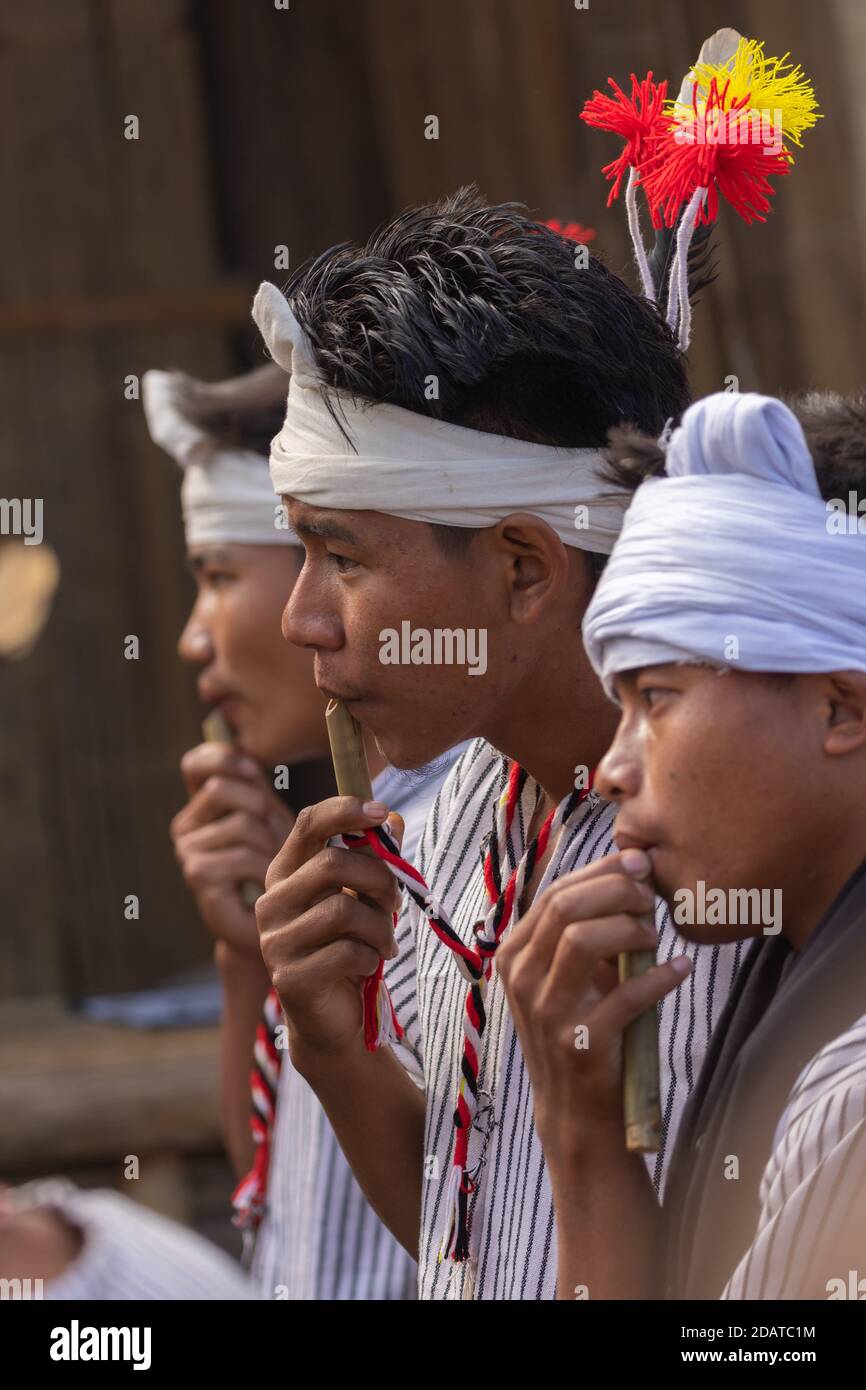 Young boys of Kuki tribe of Nagaland playing their folk music and performing at Kisama village in  Nagaland India on 4 December 2016 Stock Photo