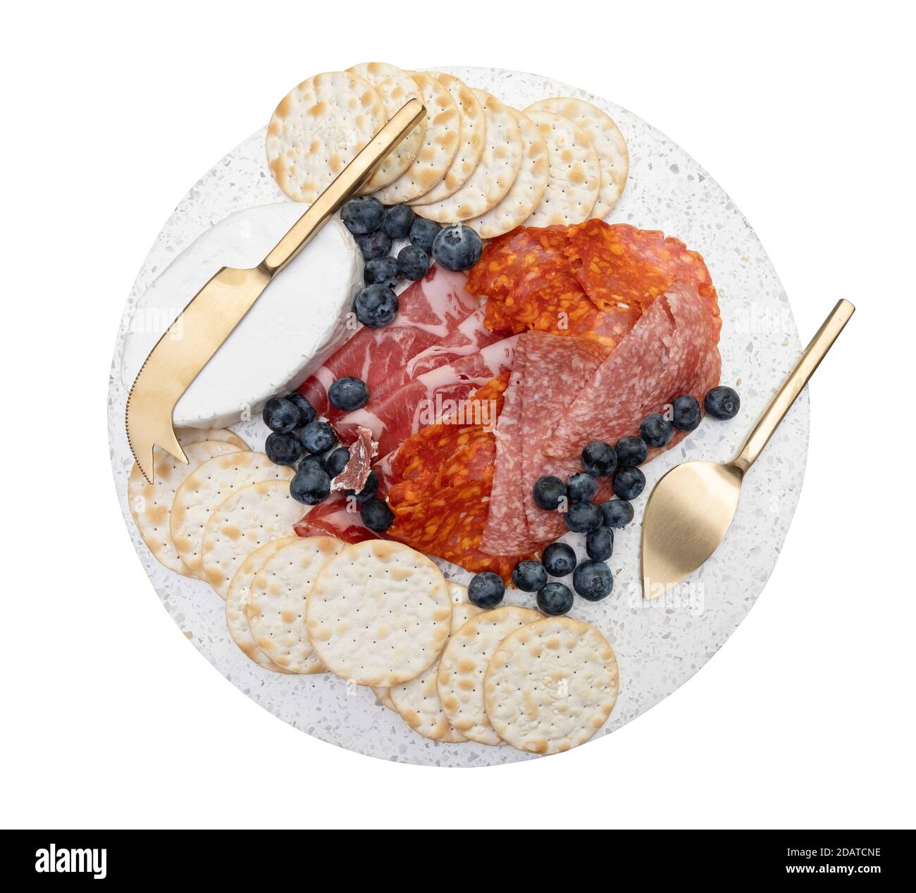 Cured meat and gourmet cheese on a plate isolated Stock Photo