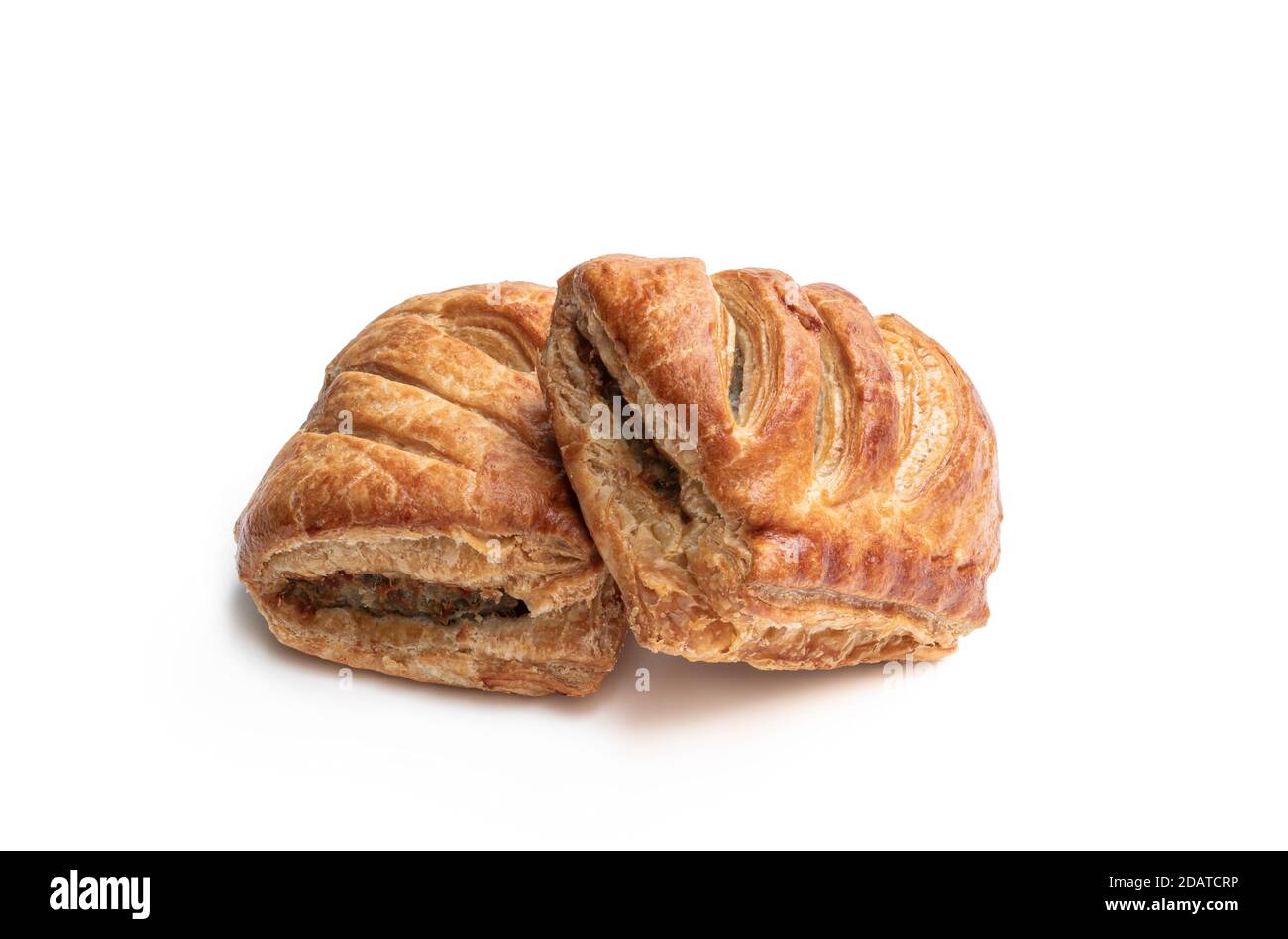 Sausage meat in puff pastry isolated on white Stock Photo Alamy