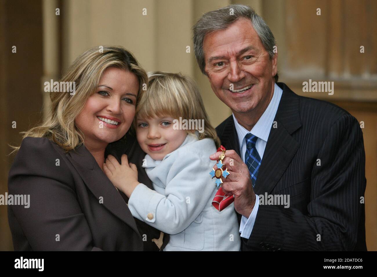 File photo dated 02/12/08 of Des O'Connor posing with his CBE for services to entertainment and broadcasting, which was presented to him by Queen Elizabeth II at Buckingham Palace, London, with wife Jodie and four-year-old son Adam. Entertainer Des O'Connor has died at the age of 88, his agent has said. Stock Photo