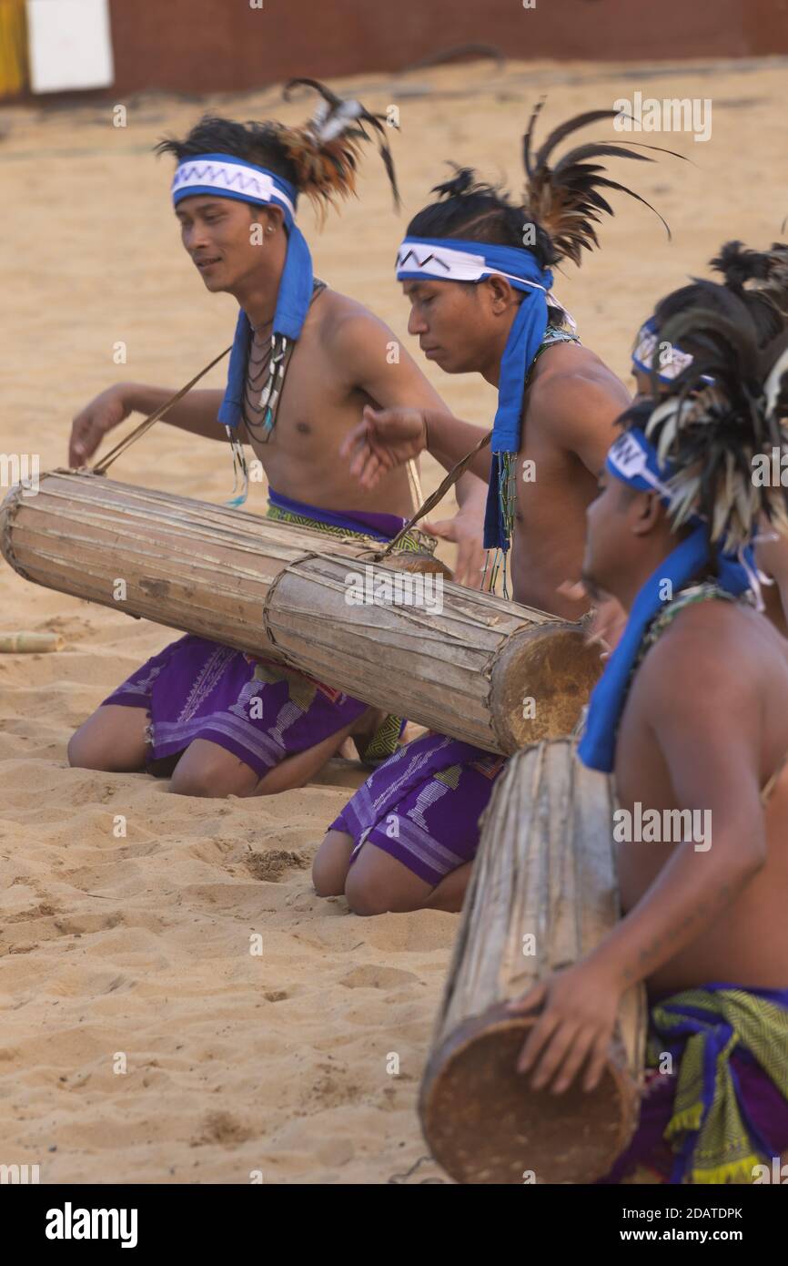 A group of young tribal boys of Nagaland playing their folk musical instruments at Kisama village Nagaland India on 4 December 2016 Stock Photo