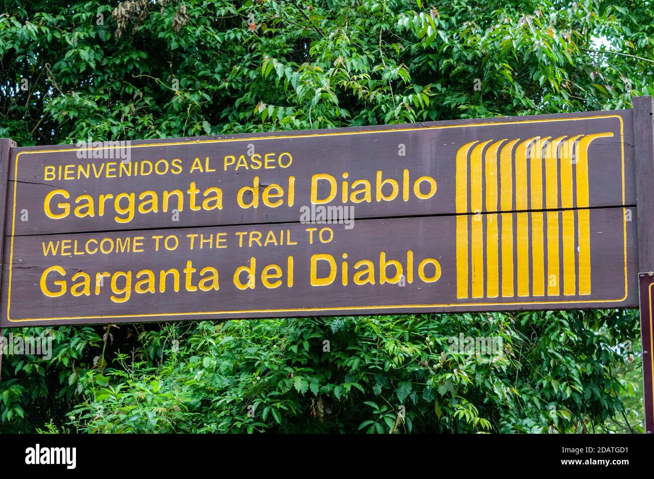 A sign of the Garganta del Diablo walking trail at the last rail station at the end of the line for the Jungle train to walk along the one-kilometre w Stock Photo