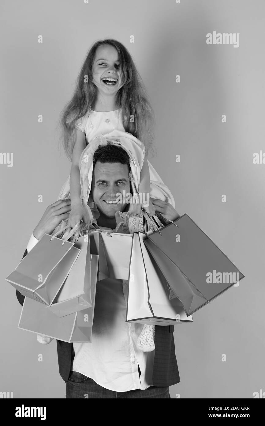 Schoolgirl and father do shopping and have fun. Shopping, presents and
