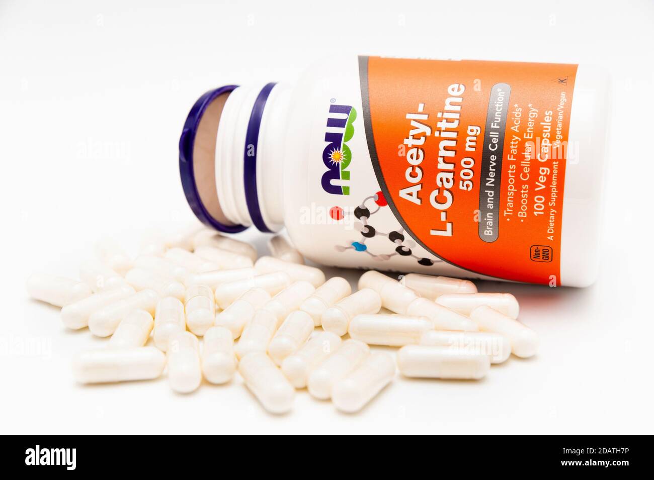 Now Foods, AcetylLCarnitine, 500 mg, 100 Veg Capsules and several scattered in front of the