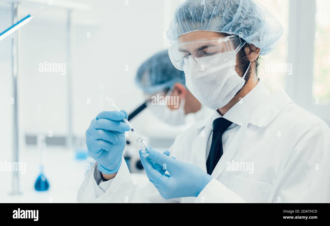background image of a laboratory assistant in a medical laboratory ...