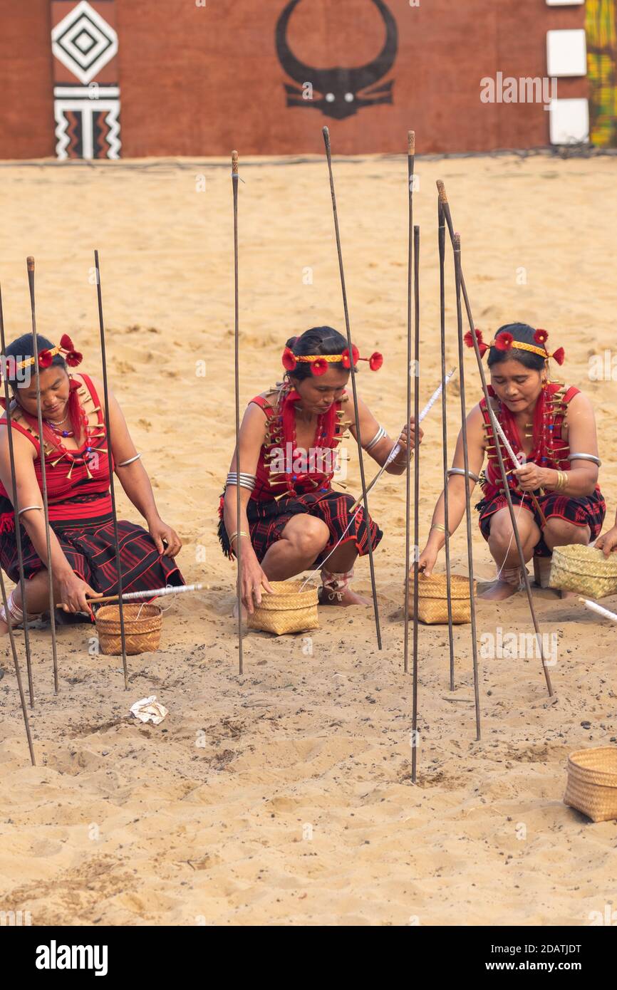 Nagol Ritual Naga women siting and performing a traditional tribal ritual in Kisama ...