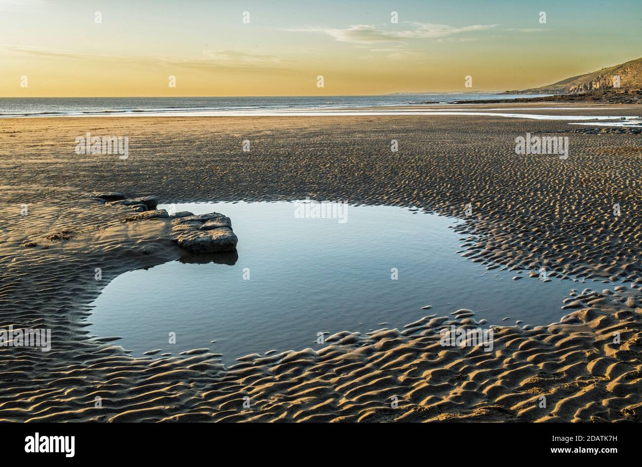 Dunraven Bay on the Glamorgan Heritage Coast in south Wales with a heart shaped pool on the beach. Stock Photo