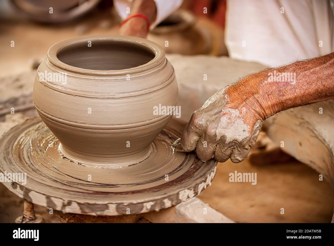 Potter at work makes ceramic dishes. India, Rajasthan. Stock Photo