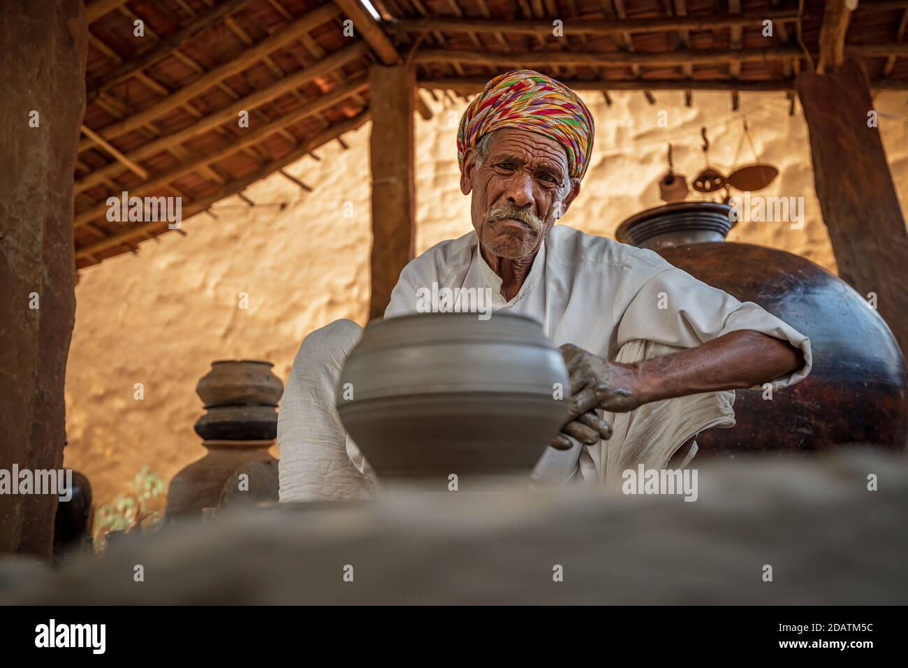 Potter at work makes ceramic dishes. India, Rajasthan. Stock Photo