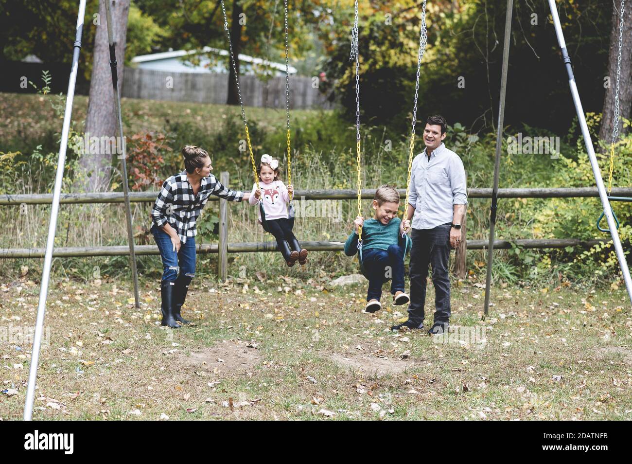 Happy family in a park Stock Photo - Alamy