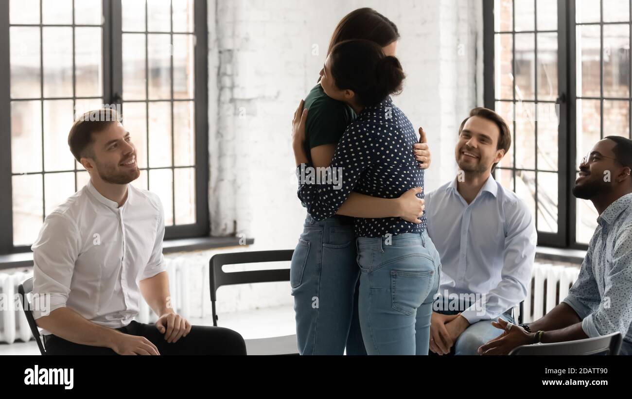 She Overcome Problem Indian female psychologist embracing young woman patient helping ...