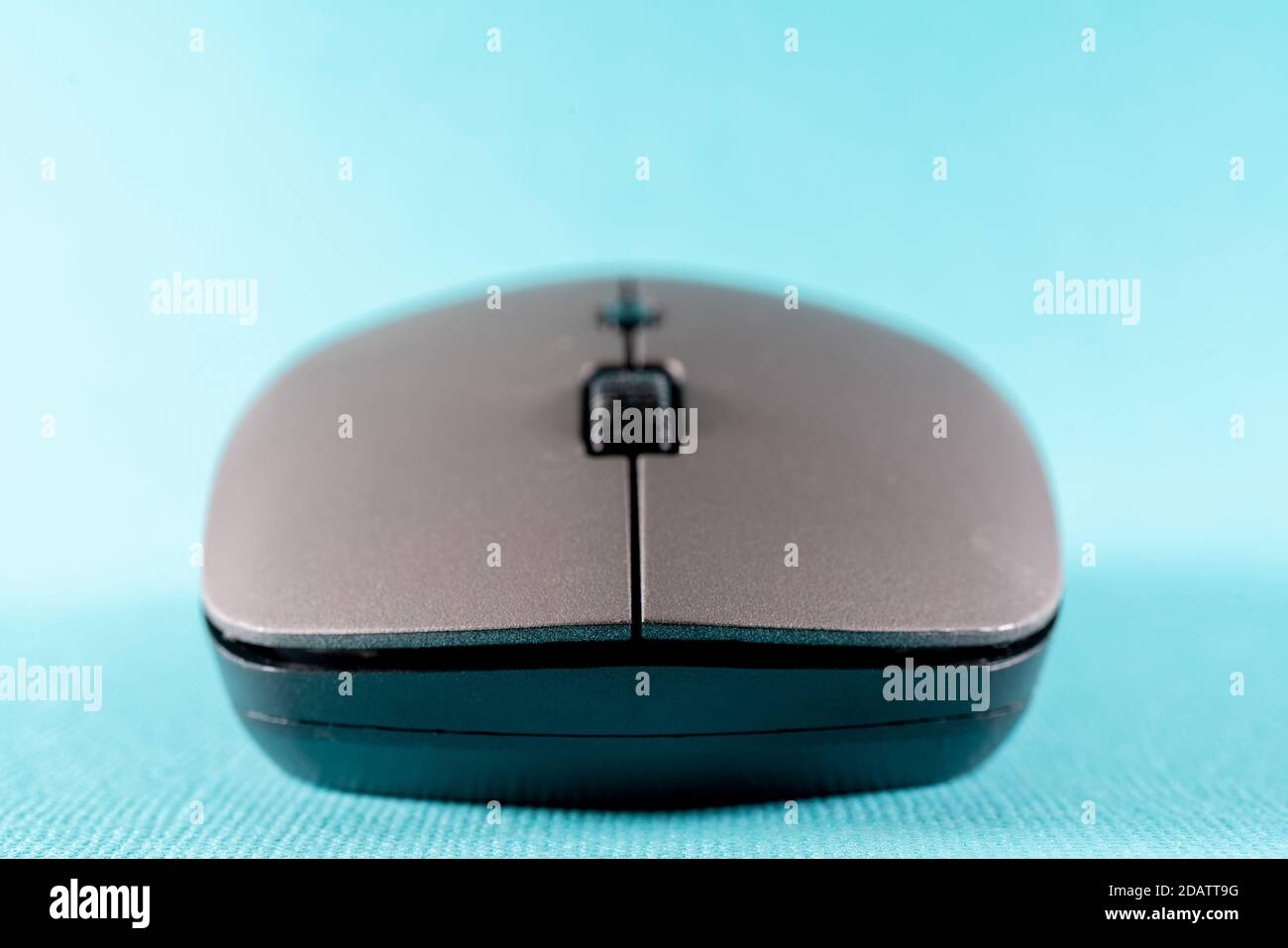 Wireless computer mouse on a blue background. Modern computer technologies. Stock Photo