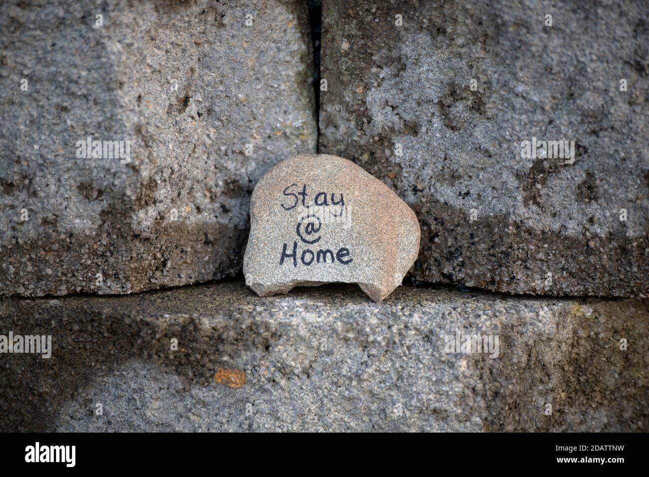 Rotherslade Bay, Swansea, UK, 15th November 2020 Painted pebble at Rotherslade Bay near Swansea this morning with a “Stay at Home” message during the Stock Photo