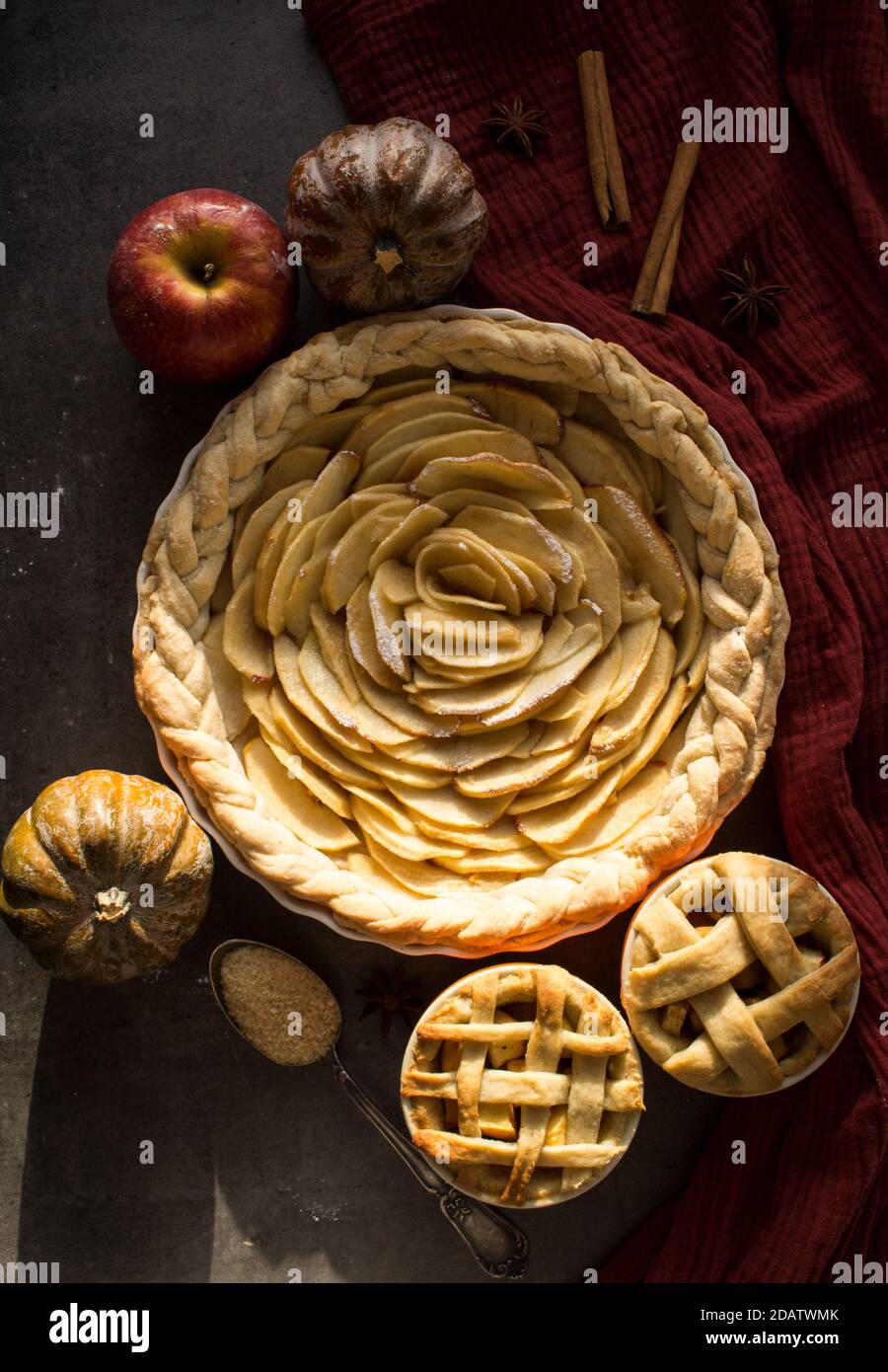 Apple pie. Dessert tarts on a table. Top view photo of various apple