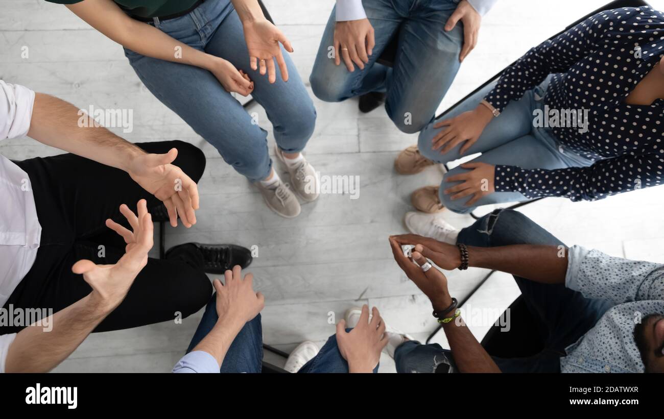 Diverse people group sitting in circle on mental therapy session Stock Photo