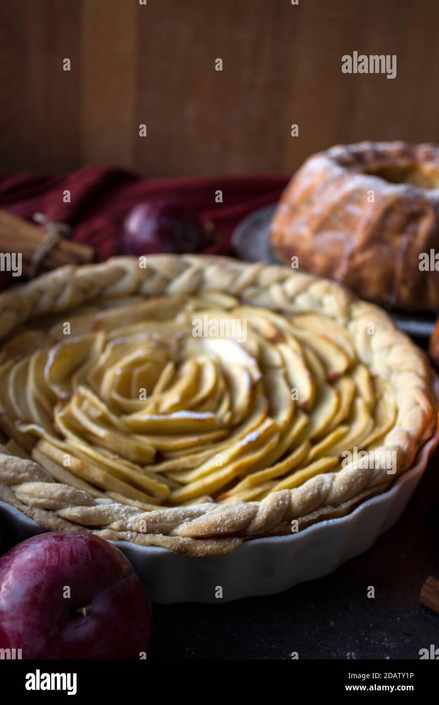 Dessert tarts on a table. Top view photo of various apple pies, cakes