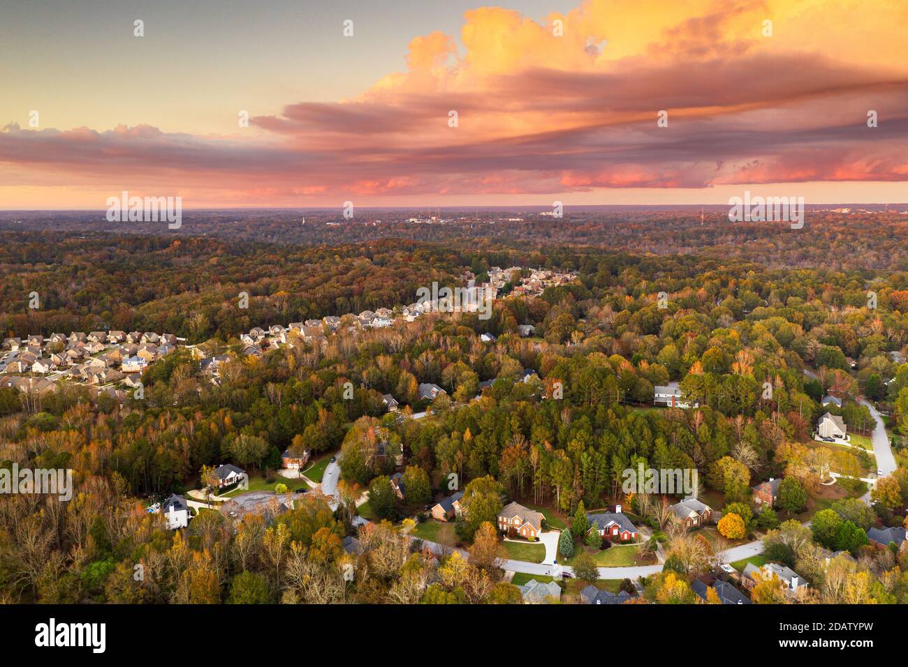Suburban neighborhoods viewed from above during an autumn dusk. Stock Photo
