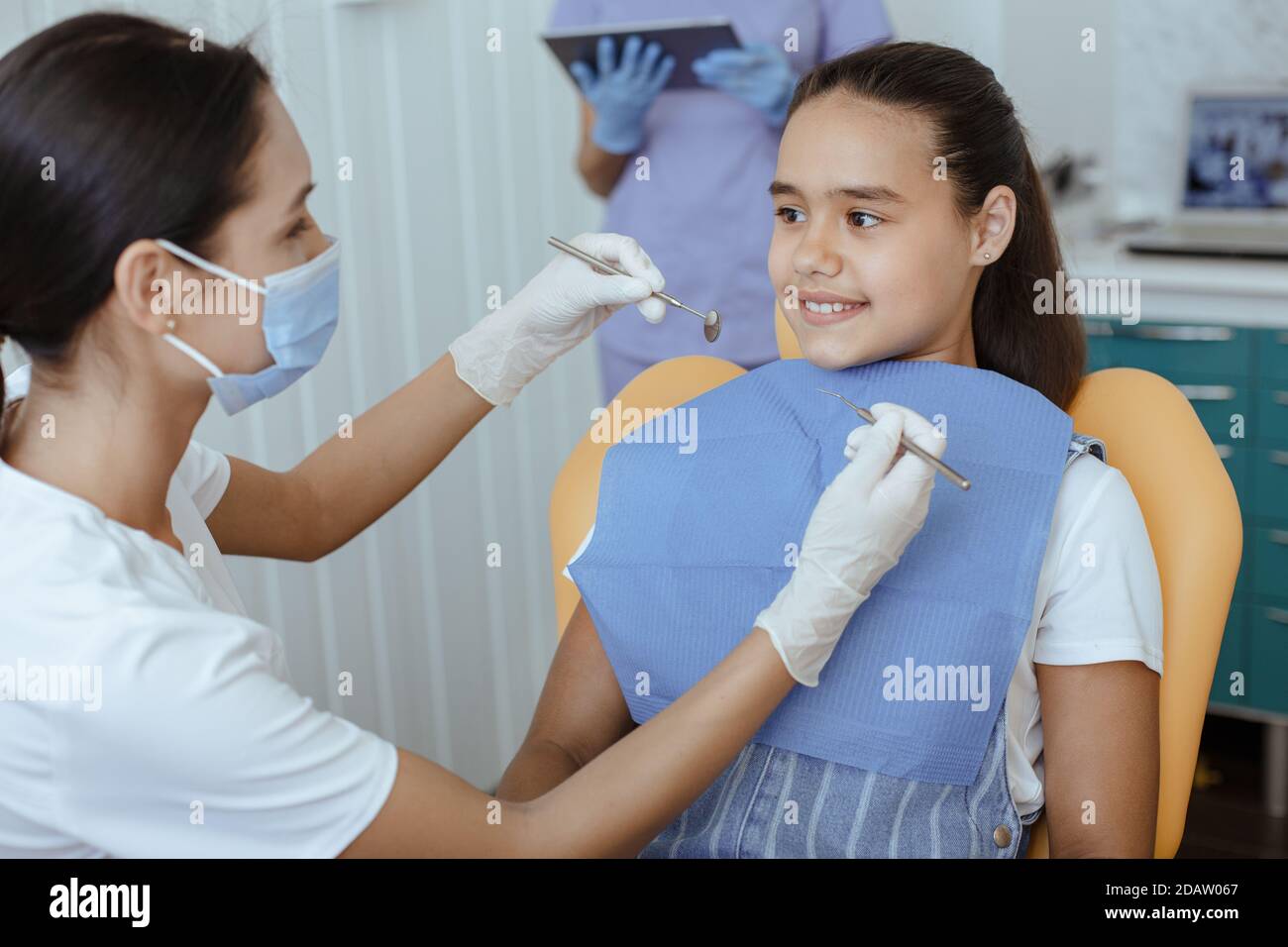 Dentist doing professional teeth cleaning and dental services Stock Photo