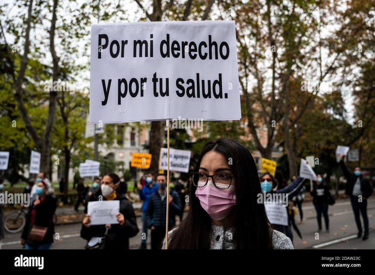 Madrid, Spain. 15th Nov, 2020. A nurse holds a placard reading 'For my rights and for your health' during a protest in front of the Healthcare Ministry where nurses are protesting demanding better working conditions and against the mistreatment of their sector during the Coronavirus (COVID-19) pandemic. Credit: Marcos del Mazo/Alamy Live News Stock Photo