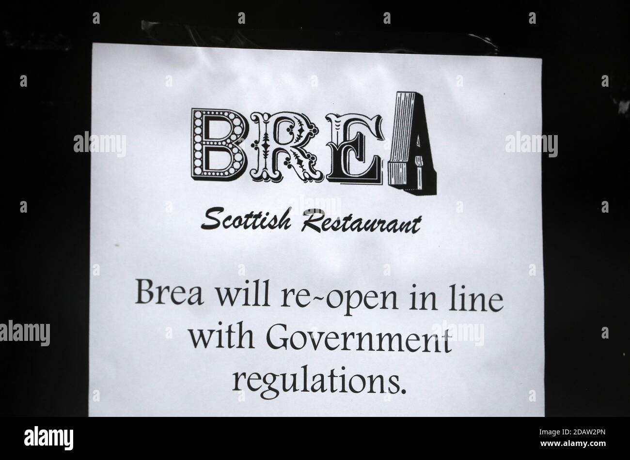 A sign in a restaurant window in Stirling telling customers they are following Government