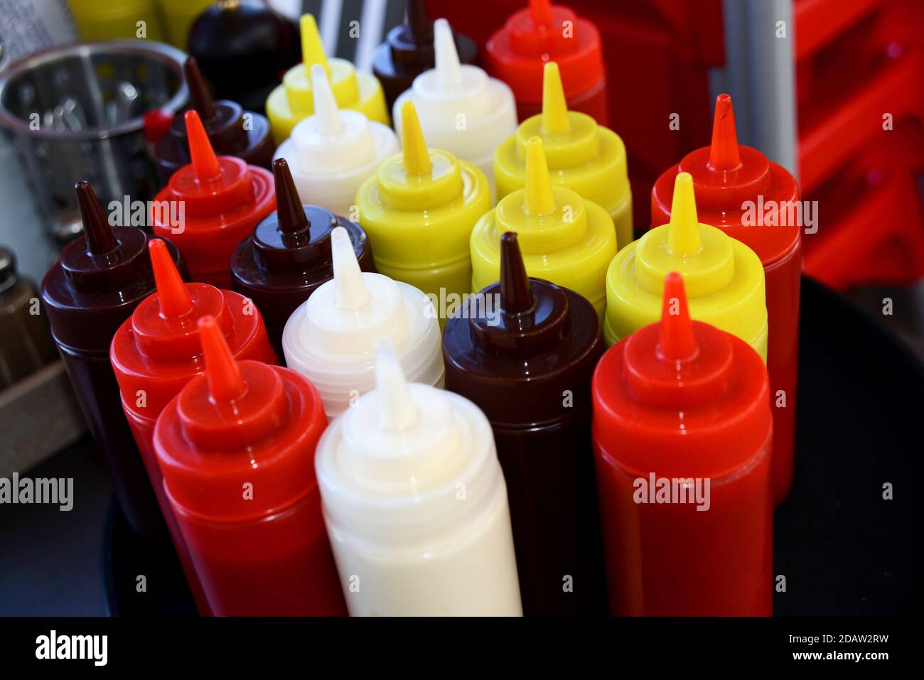 Colourful sauces bottles in a cafe in Brighton, East Sussex, UK Stock