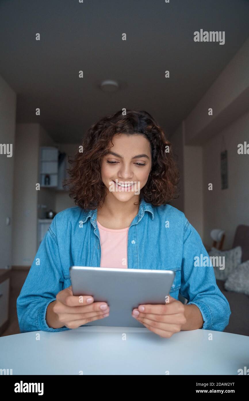 Young woman using computer tablet and working and studying online. Stock Photo