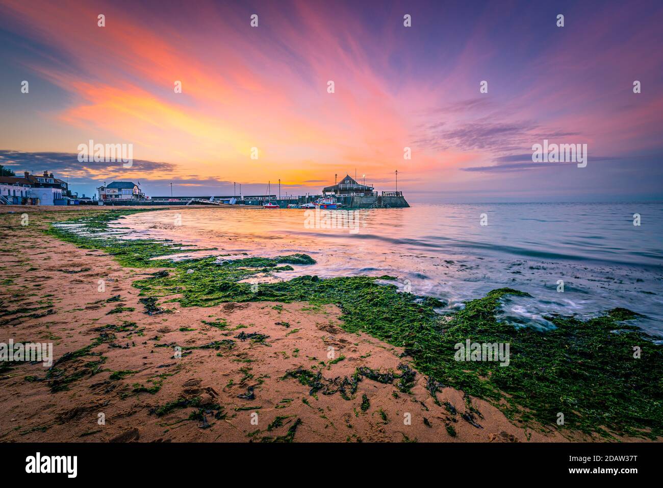 Broadstairs Pier In Thanet, Kent In The United Kingdom At Dawn With The Sun Rising Behind Stock Photo