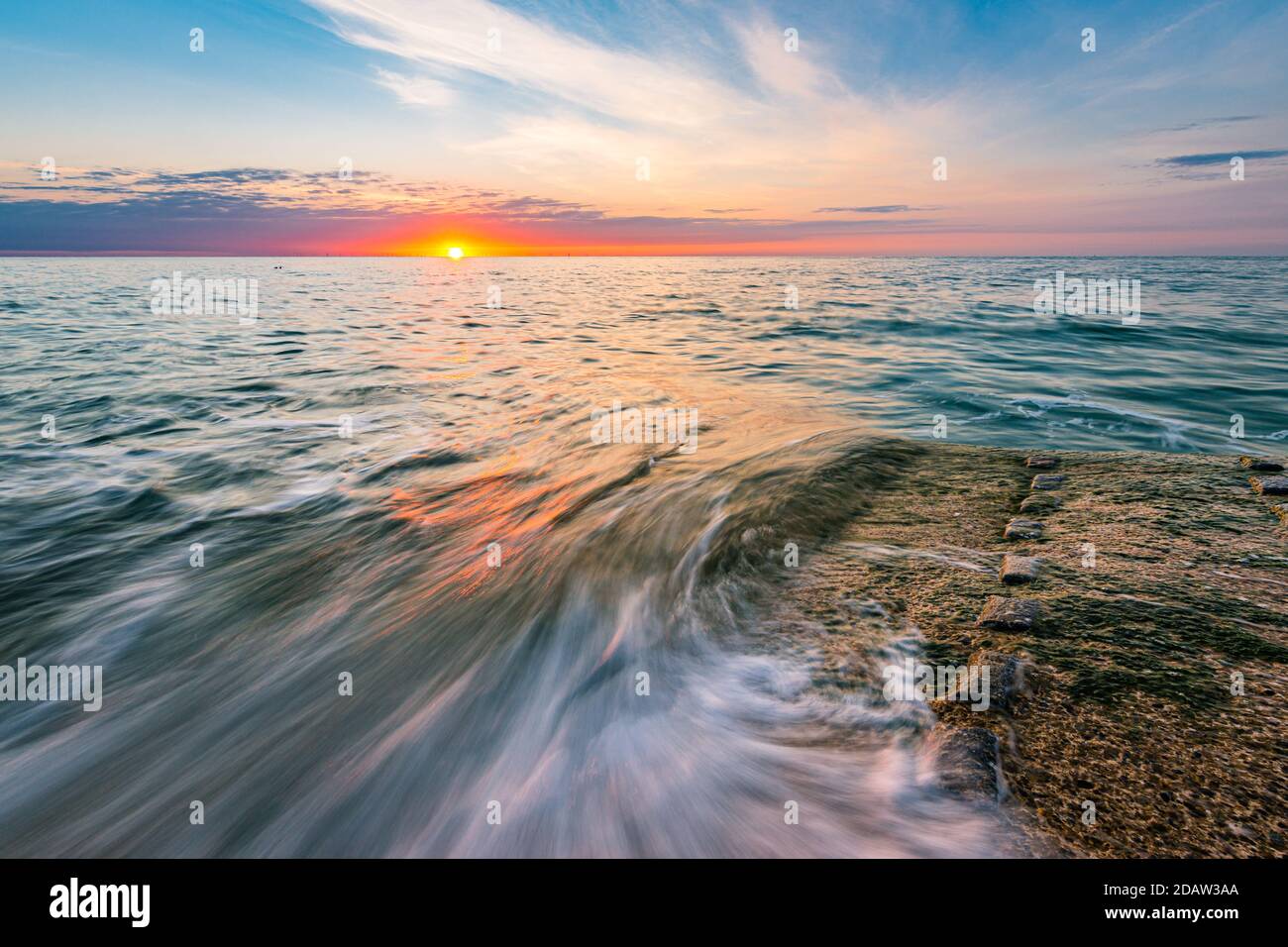 Summer Sunrise At Broadstairs In Kent United Kingdom With The Waves Swirling Stock Photo