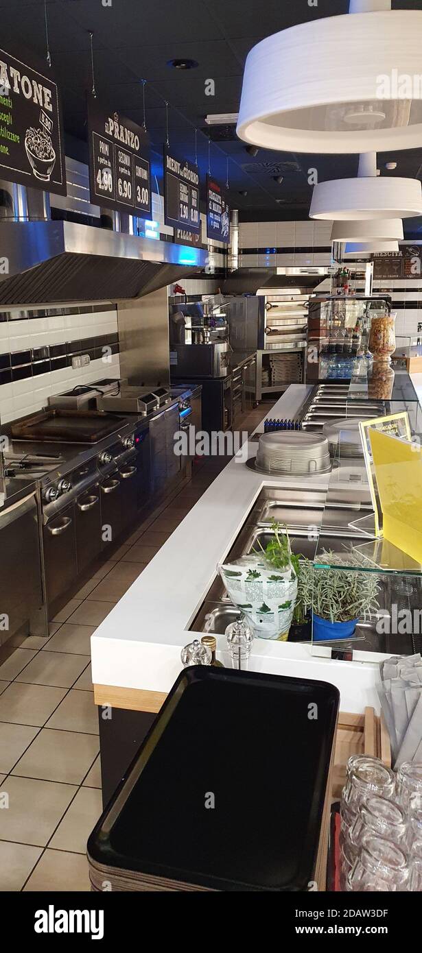 empty food and restaurant at the counter area with chairs upside-down for quarantine and lockdown in COVID-19 times waiting to open and make money Stock Photo
