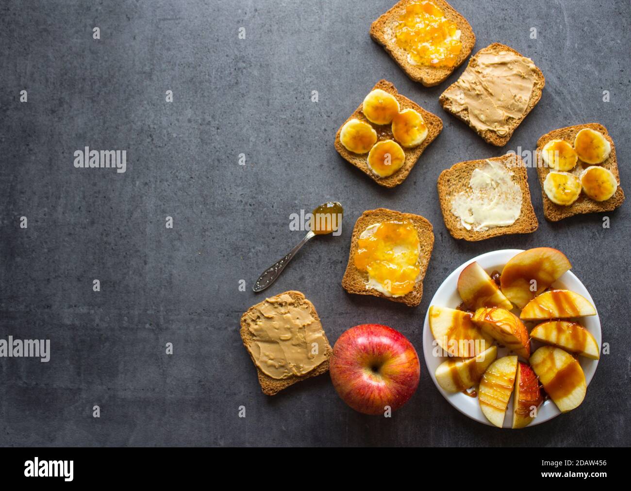 Frame or border made of toast bread with different toppings. Sweet