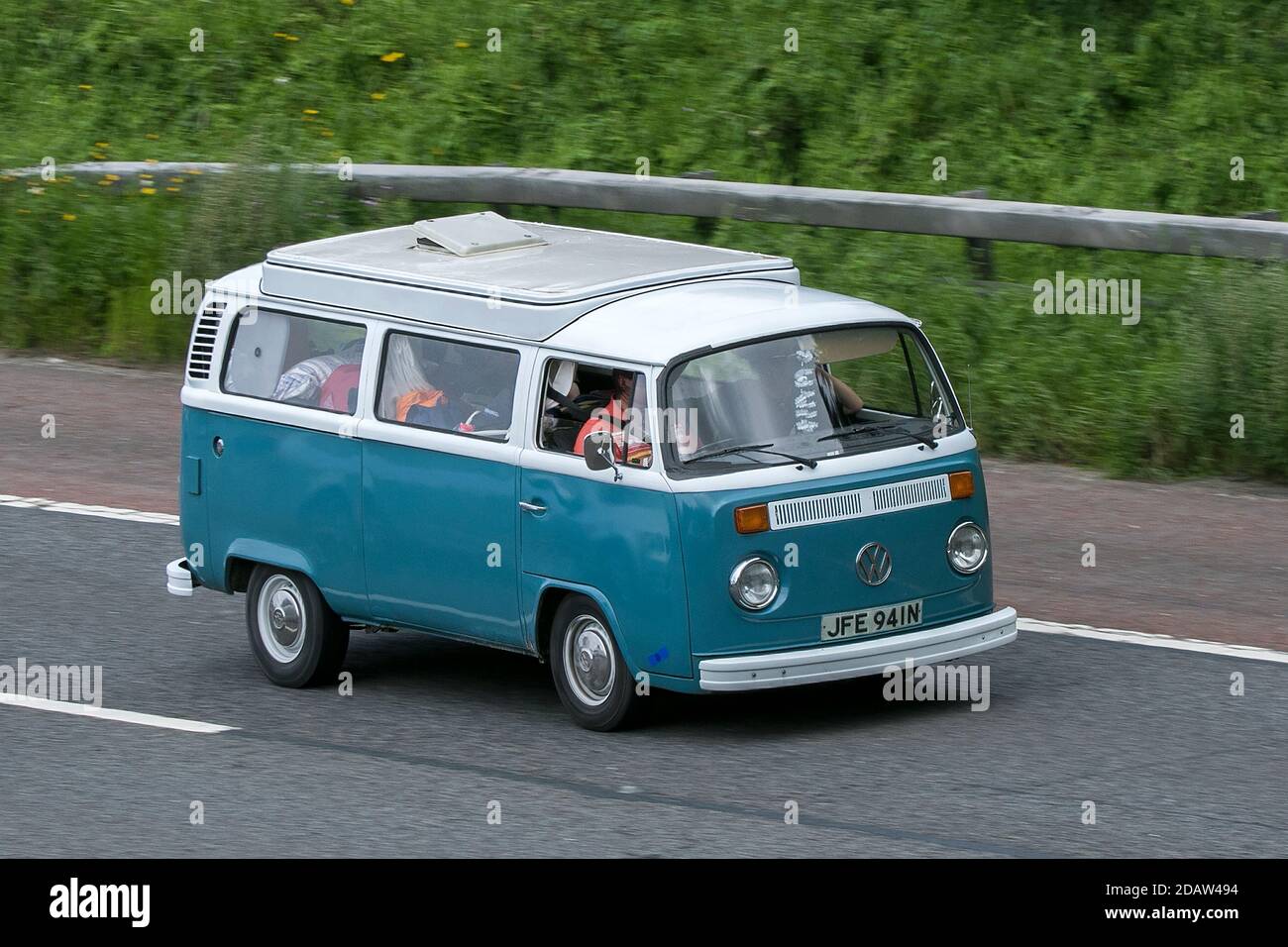 1975 blue white VW Volkswagen Motor Caravan driving on the M6 motorway near Preston in Lancashire, UK. Stock Photo