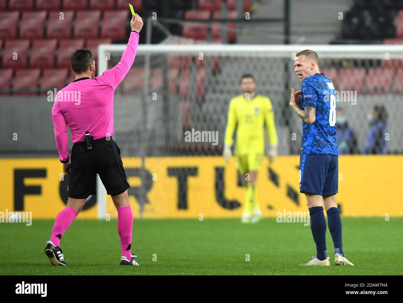 Referee Istvan Kovacs (left) shows a yellow card to Slovakia's Ondrej Duda for a foul on Scotland's John McGinn (not pictured) during the UEFA Nations League Group 2, League B match at City Arena, Trnava, Slovakia. Stock Photo