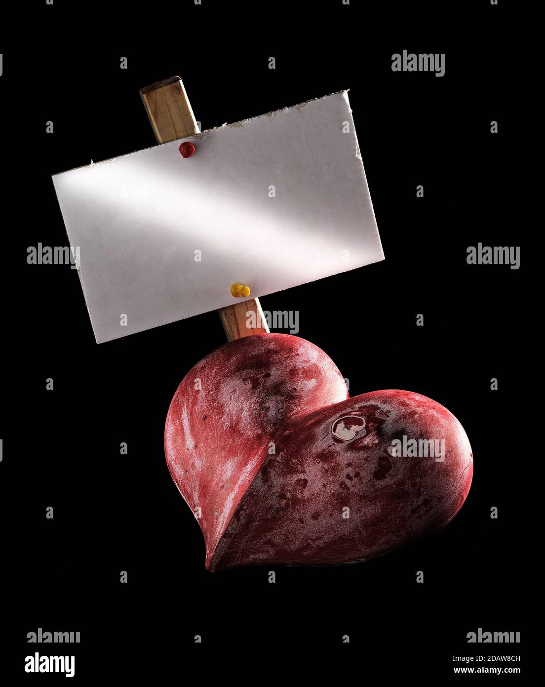 A worn out heart with a blank sign. Stock Photo