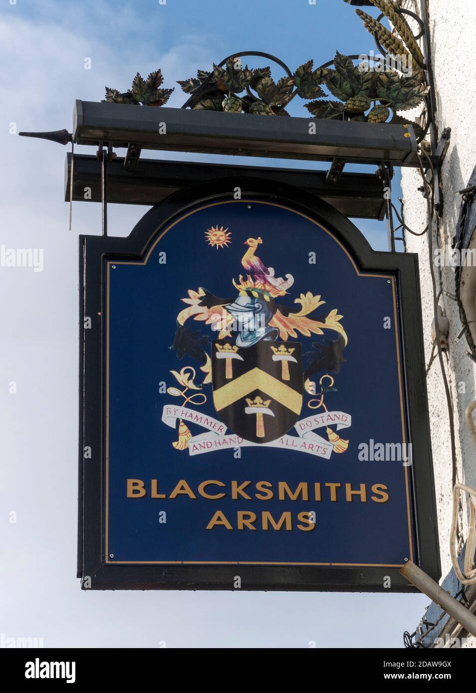 Traditional hanging pub sign at The Blacksmiths Arms public house, High