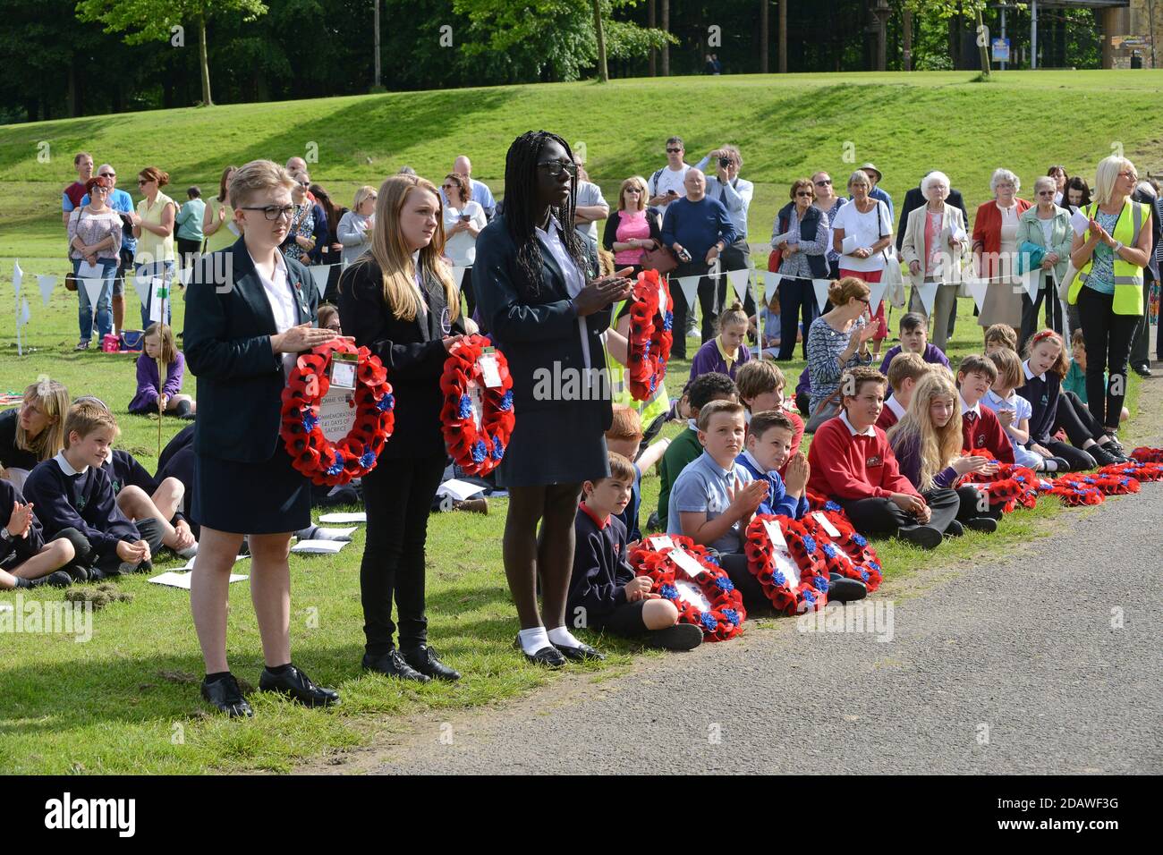 School children commemorate the Shropshire soldiers that lost their live in the Somme during WW1. Historic England and the Royal British Legion orgami Stock Photo