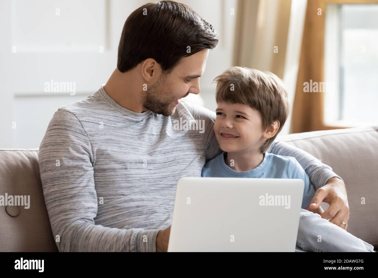 Boy hugging laptop hi-res stock photography and images - Alamy