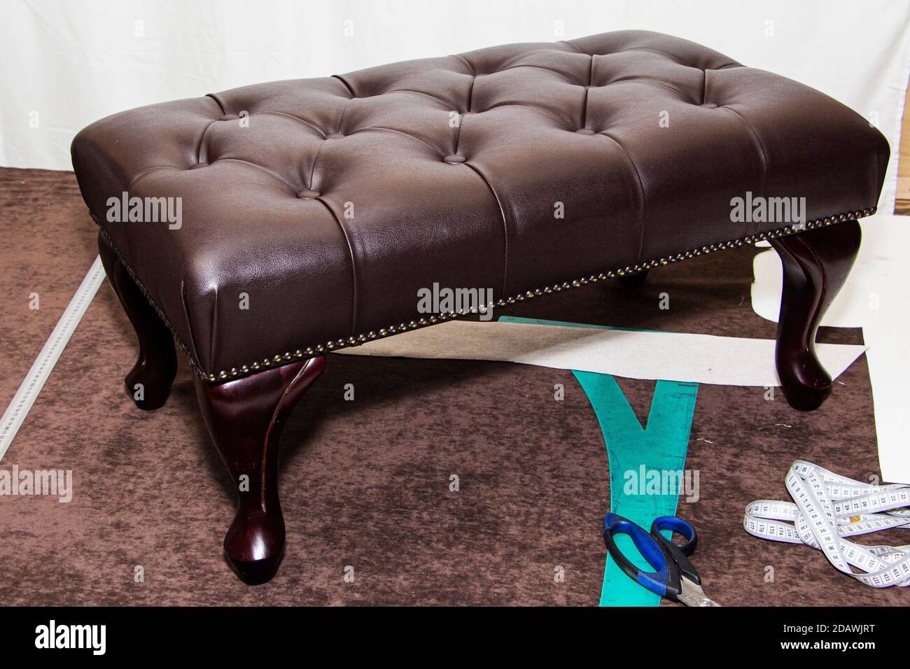 black leather background with damaged surface, furniture repair Stock