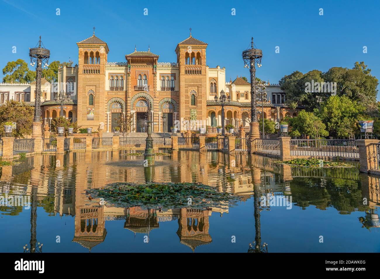 The Plaza de America and the Museum of Popular Arts in Seville, Andalusia, Spain It is located in the Parque de Maria Luisa. Stock Photo