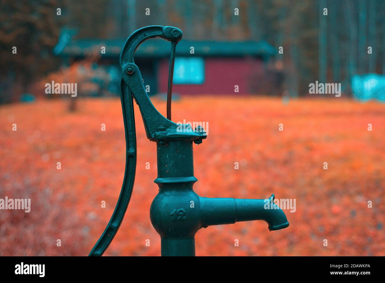 A hand water pump near a summer cottage in Sweden. Stock Photo