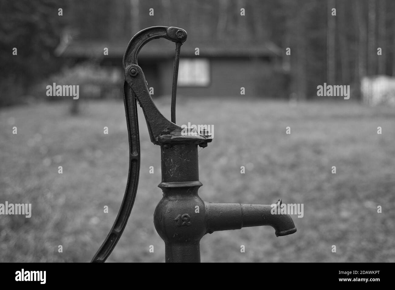 A hand water pump near a summer cottage in Sweden. Stock Photo