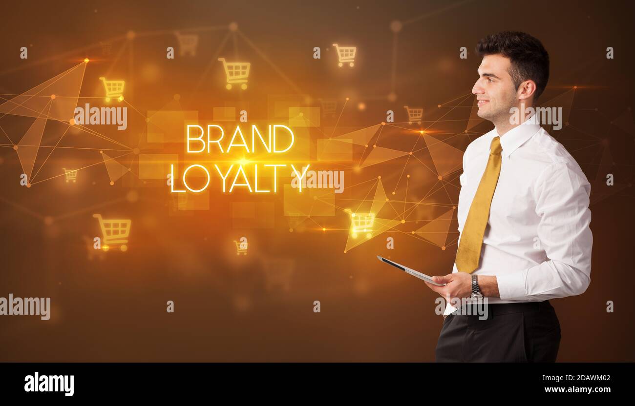 Businessman with shopping cart icons and BRAND LOYALTY inscription ...
