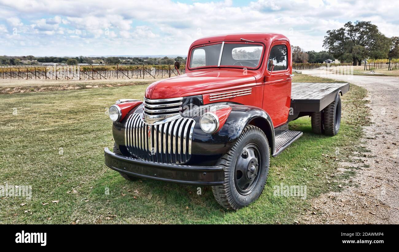 Fredericksburg,Texas- Nov.12-2020  Augusta Vin Winery in Texas Hill Country with 1942 GMC wine truck and vineyards in the background. Stock Photo