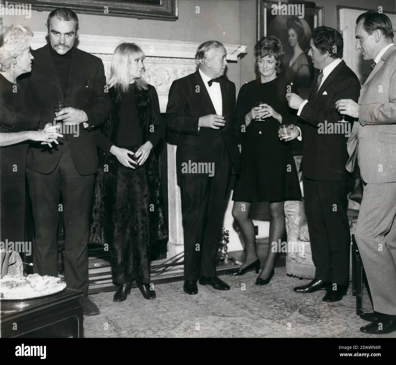 Dec. 12, 1969 - London, England, United Kingdom - The Prime Minister HAROLD WILSON, center, and his wife host an arts council reception at No. 10 Downing Street in support of Theatre Organisation for Children and Young People. Photo shows, from left, JENNIE LEE, Minister with Special Responsibility for the Arts; actor SEAN CONNERY, his wife actress DIANE CILENTO, PM Wilson, actress ELSPET GRAY, Actor BRIAN RIX and ERIC PORTER. (Credit Image: © Keystone Press Agency/Keystone USA via ZUMAPRESS.com) Stock Photo