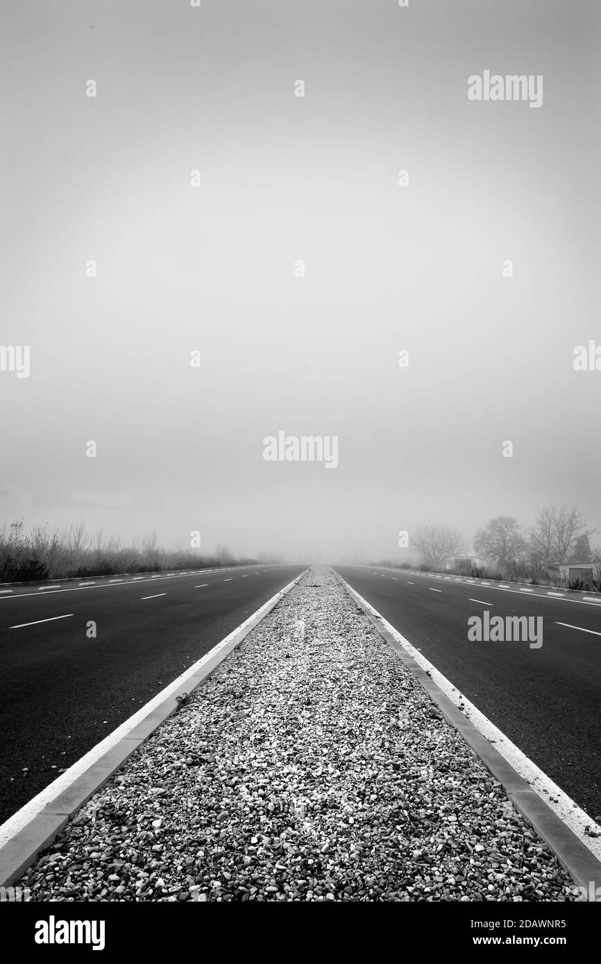 Highway with cloudy fog, transportation and travel, landscape Stock Photo